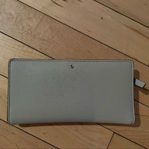 Beige kate spade roulette slim bifold wallet